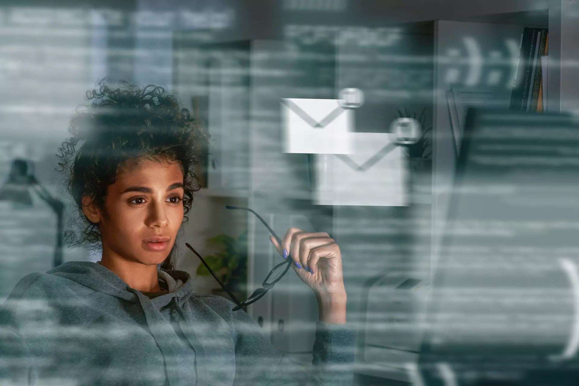 Professional surrounded by scattered devices and dashboards, symbolizing systems overload before discovering a Business Momentum System that simplifies everything.