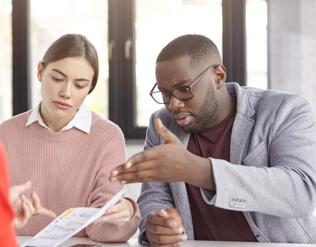 Two people looking at a confusing dashboard